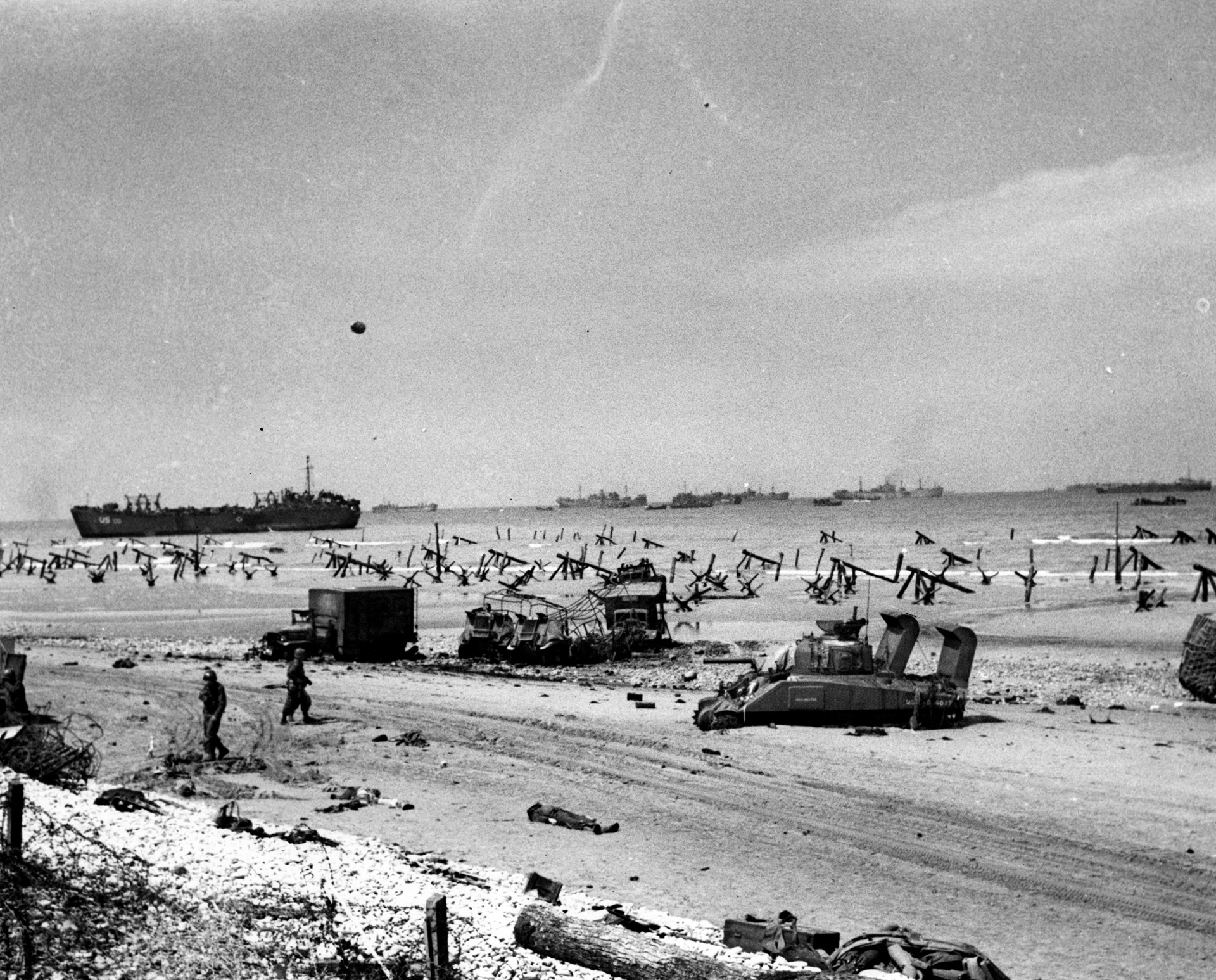 Low tide reveals the detritus of war strewn across the Easy Red sector of Omaha Beach, but the battle, although costly, has been won. Hitler’s supposedly impregnable “Atlantic Wall” is breached within the span of a morning.
