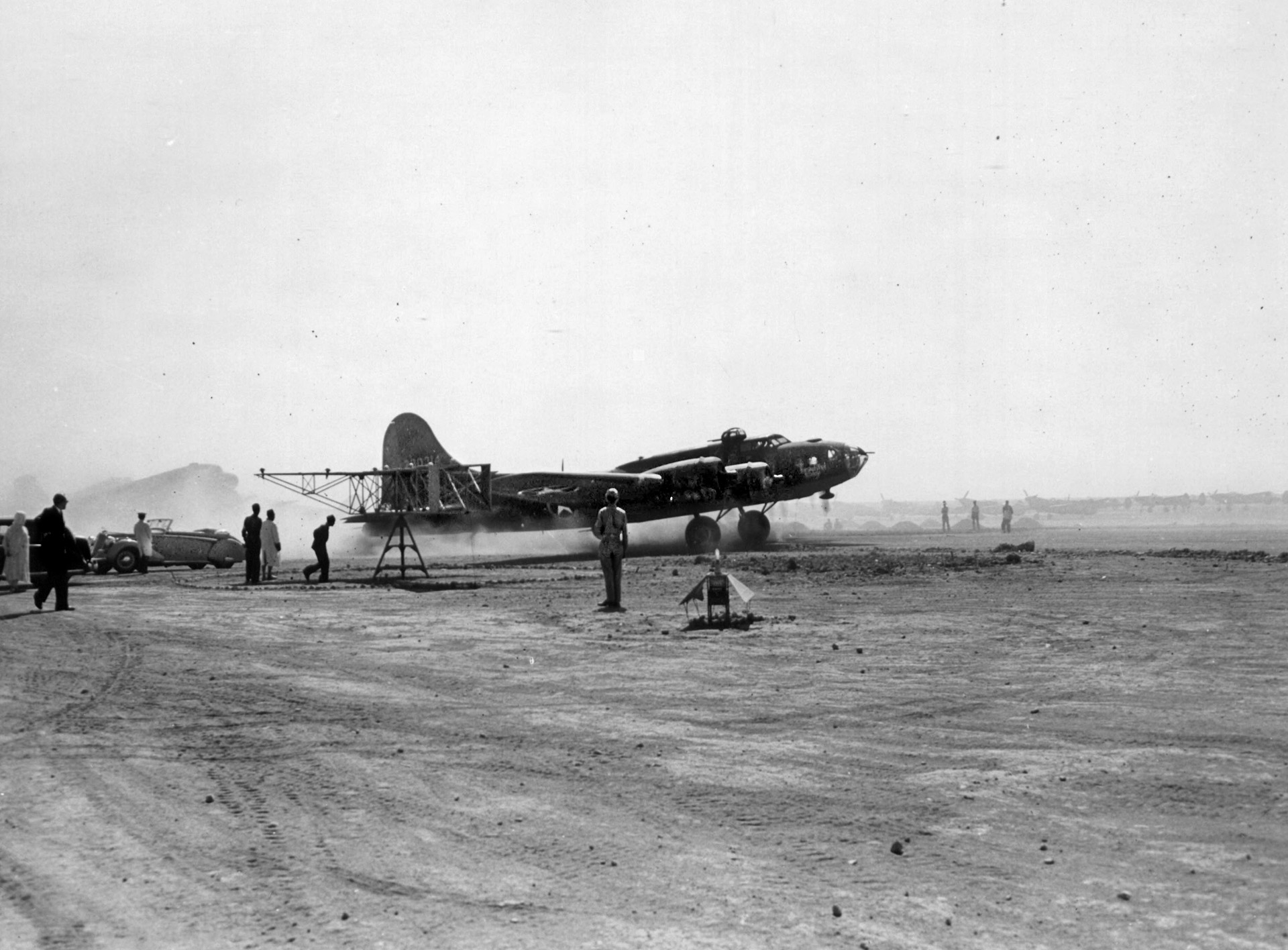  A B-17 from an unidentified squadron raises a cloud of dust as it prepares to take off from an airfield in North Africa on a bomb run over Italy, 1943. Lt. Perry and his crew arrived in North Africa in October 1943.