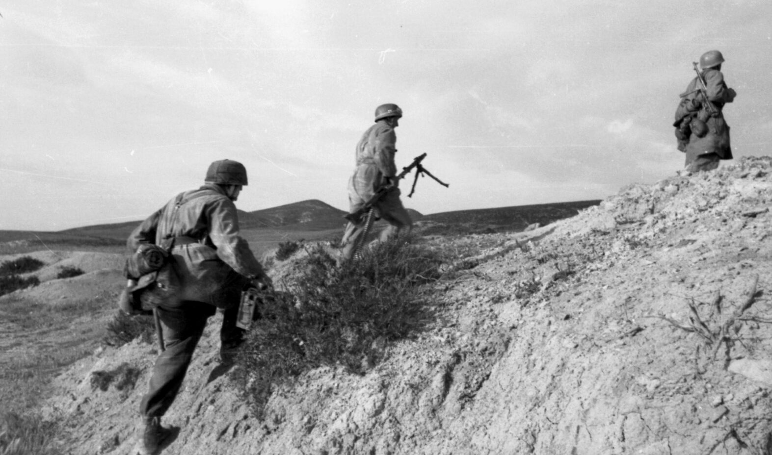 Members of the German 1st Parachute Division dash to a new position during the battle for Sicily. Unlike the Italians, the Germans did not give up ground easily.