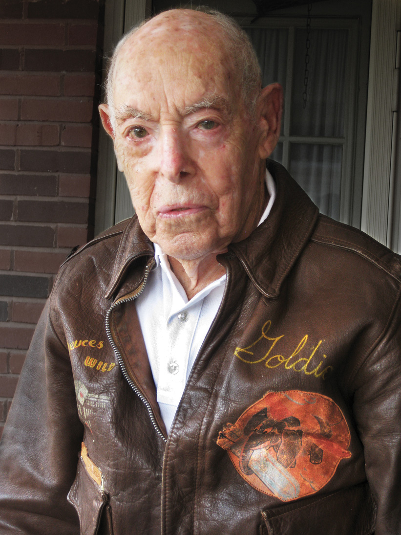 99-year-old Ralph Goldsticker models his A-2 flight jacket, which still fits like a glove. His nickname “Goldie” is emblazoned on the front. 