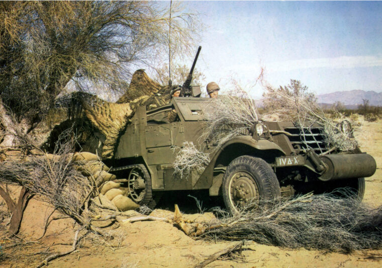 A camouflaged half-track playing the role of a tank destroyer pauses in the blistering desert heat of the American West during maneuvers. Desert training in the United States was intended to prepare American soldiers for the hardships of combat in North Africa.