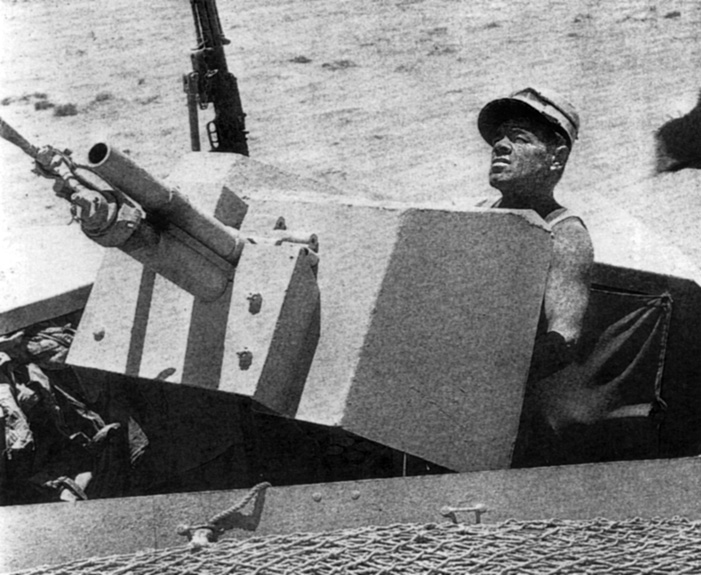 A French Foreign Legionnaire scans the skies in search of enemy planes over the North African desert during the fight against Rommel’s Afrika Korps.