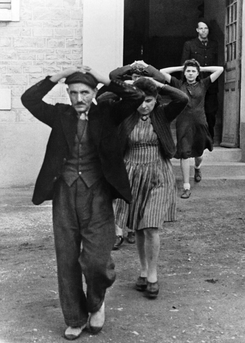 French civilians are arrested by Germans. Anyone caught resisting the occupiers was subject to arrest, incarceration in a concentration camp, or death.