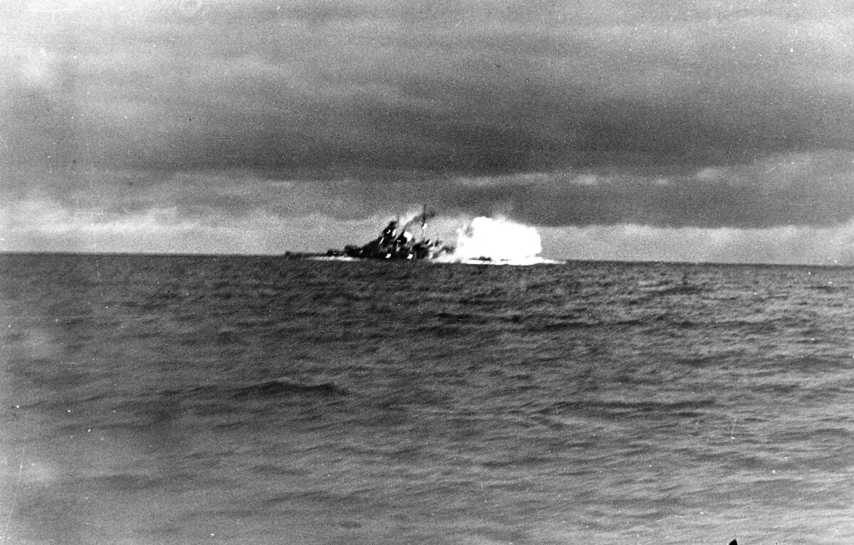 Smoke rises from Hood moments after the fatal hit from Bismarck that resulted in the immediate destruction and sinking of the British battlecruiser. 