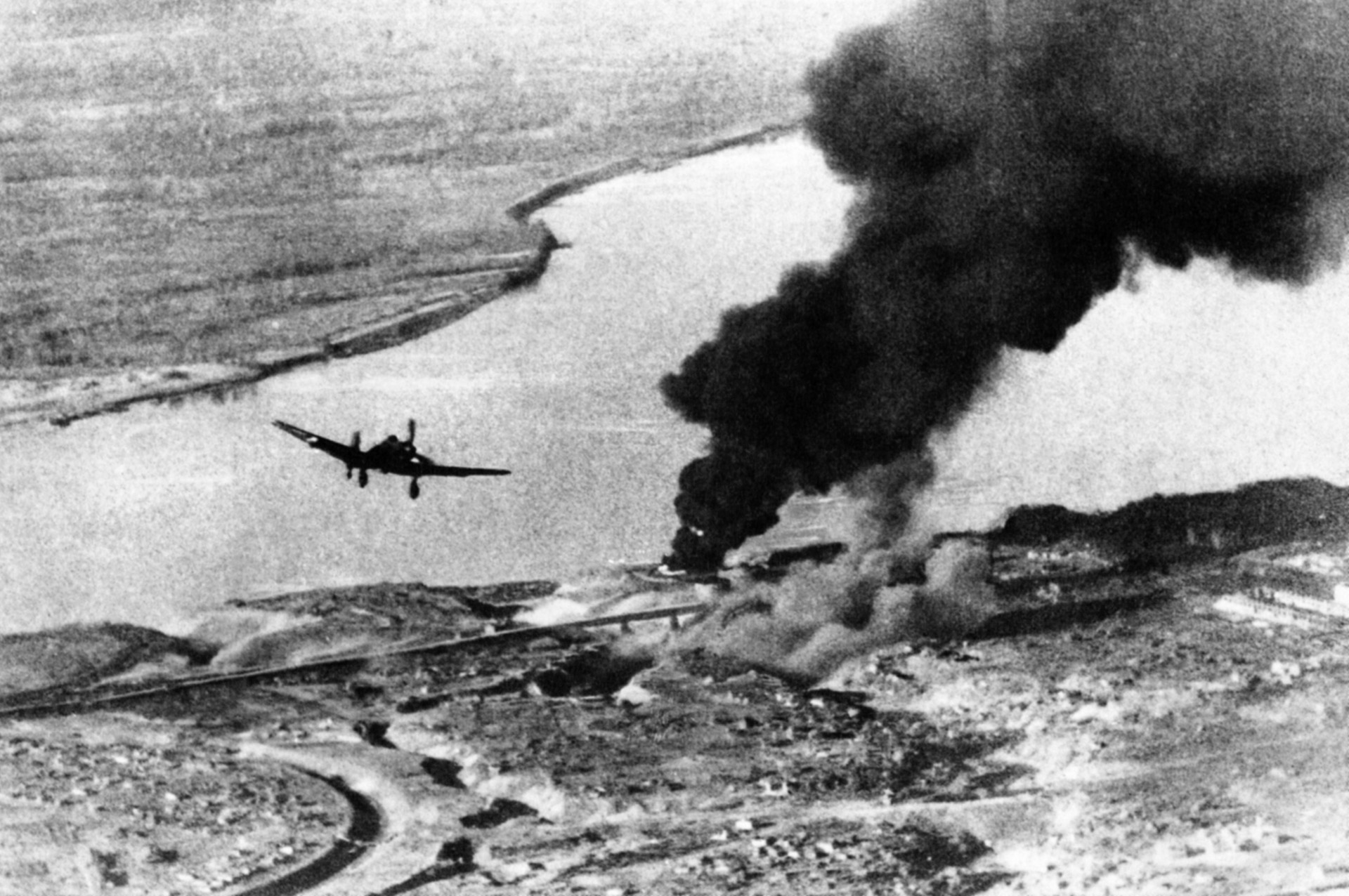 Leaving its target along the Volga River on the outskirts of Stalingrad burning, a Stuka dive bomber pulls up and heads for its home base.