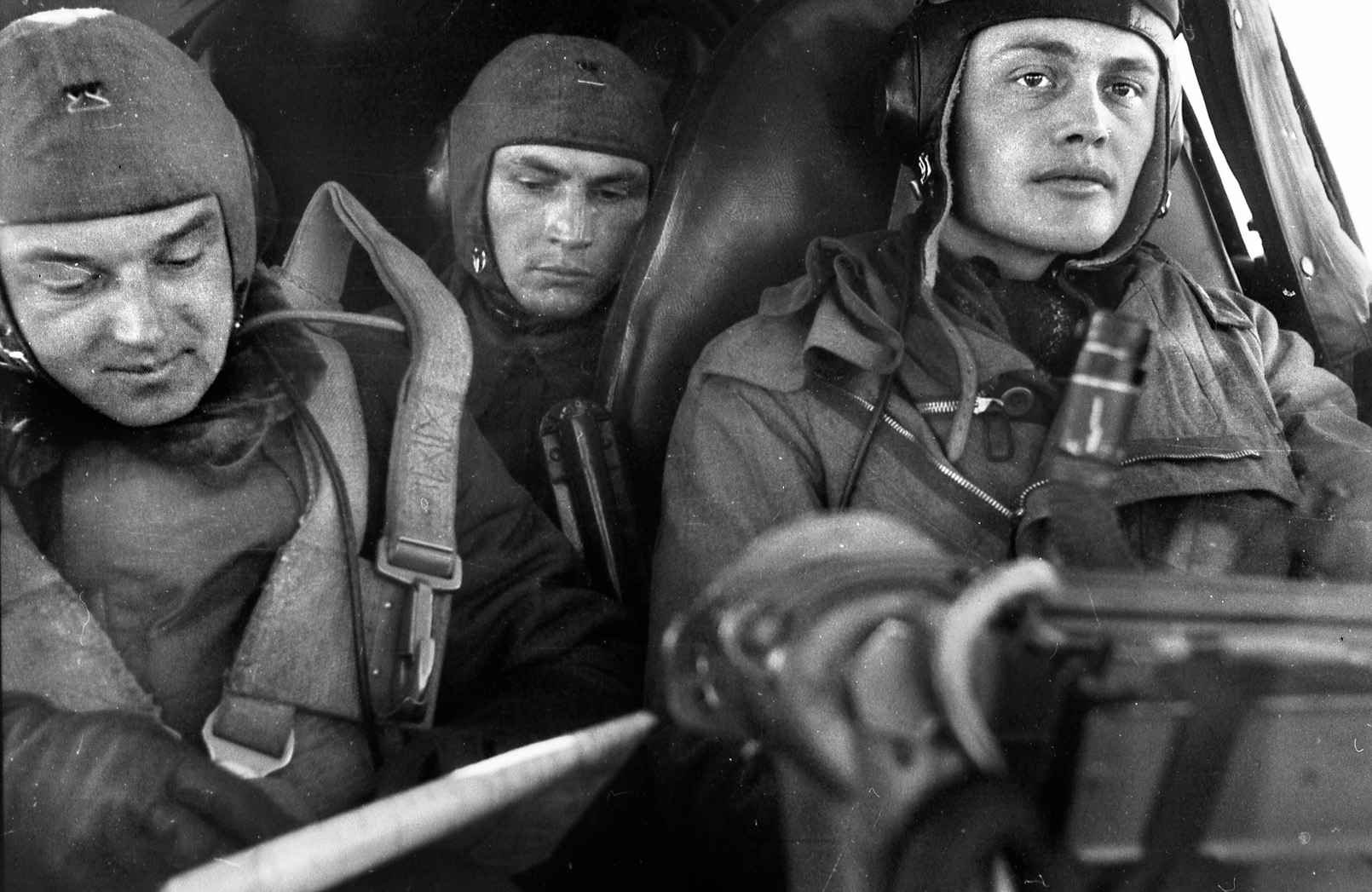 In the cramped cockpit of a Heinkel He 111 bomber, the co-pilot (left) studies a map of Stalingrad before taking off to bomb the city. 