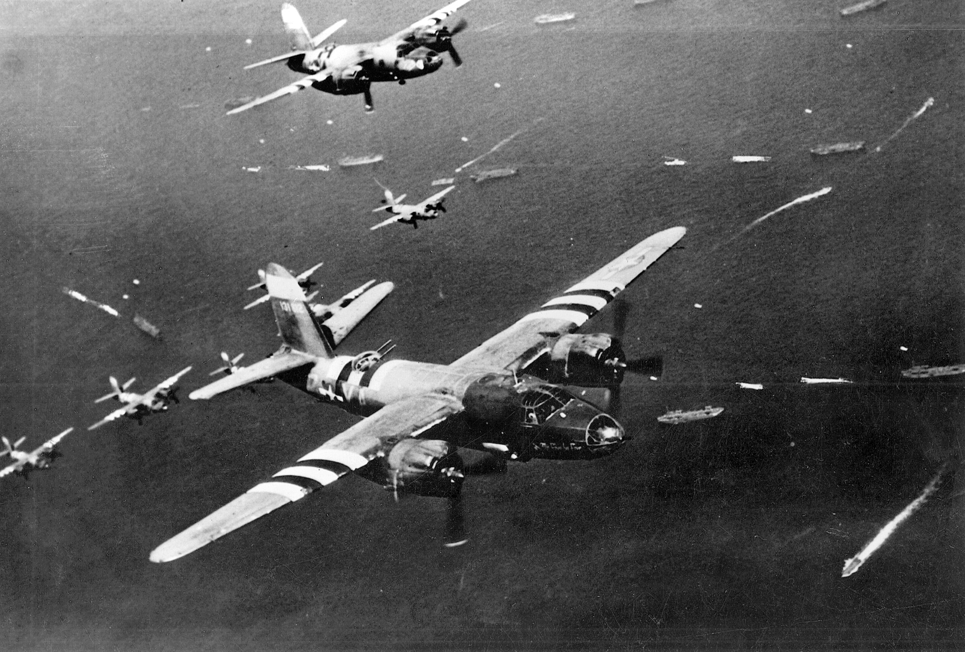 American Martin B-26 Marauder medium bombers head across the English Channel to drop their payloads on German positions. BELOW: An aerial photograph of the territory after the Cobra bombings showing the immense and concentrated destruction. 