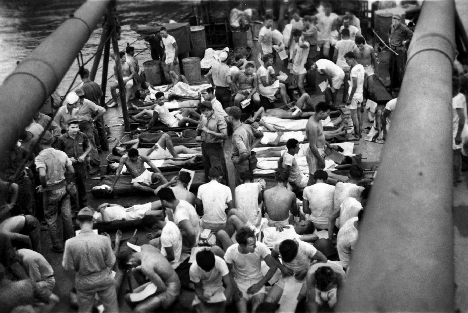 Rescued Indy survivors in clean clothes crowd the deck of the high-speed transport USS Bassett. The Navy kept the lid on news of the sinking until after the war. 