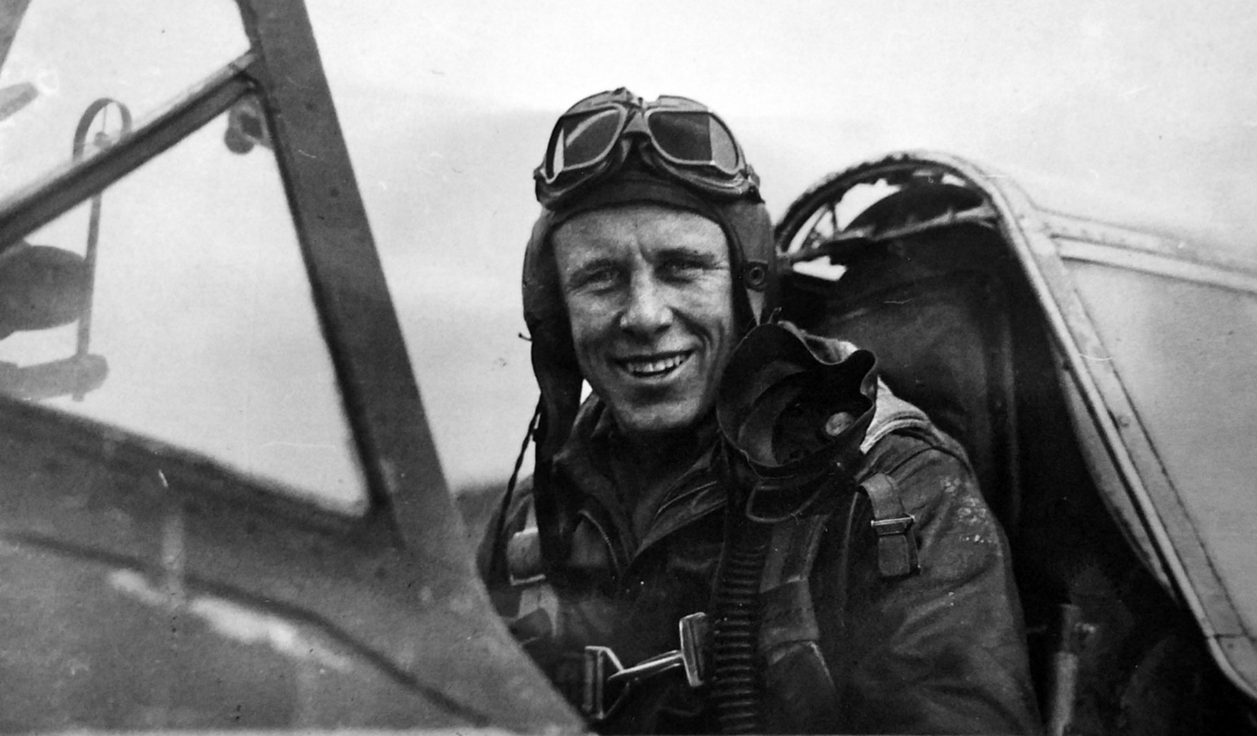 Lieutenant Ed Cottrell smiles from the cockpit of a fighter in 1944. He completed 65 combat missions.