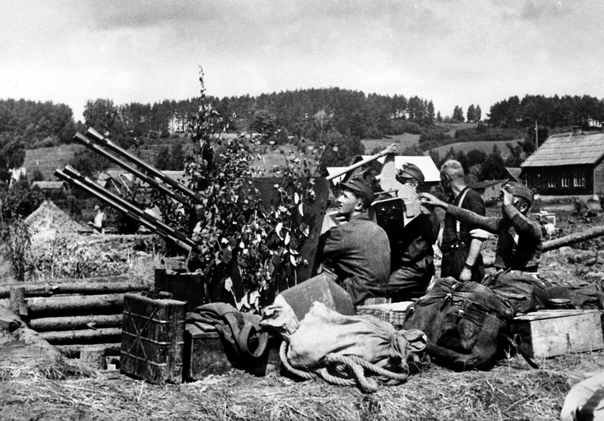 Young crewmen train on a camouflaged, four-barrel 2cm Flakvierling 38. The gun had a combined firing rate of 1,400 rounds per minute.