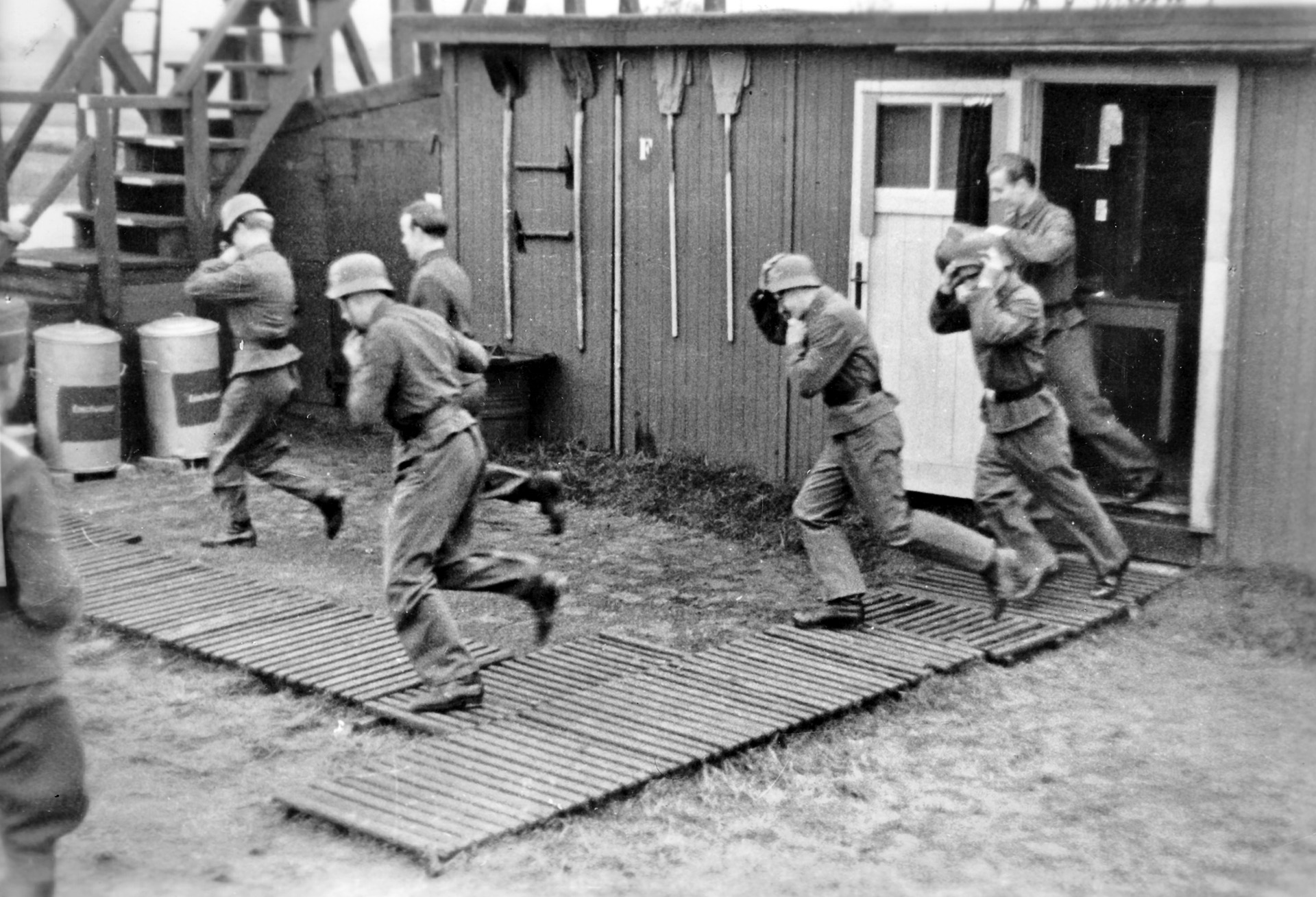 Young Luftwaffe gunners somewhere in Germany strap on their helmets as they rush to their guns at the start of an Allied air raid. Many years later, Gunther met with the family of an American fighter pilot he believes he had shot down in 1944.