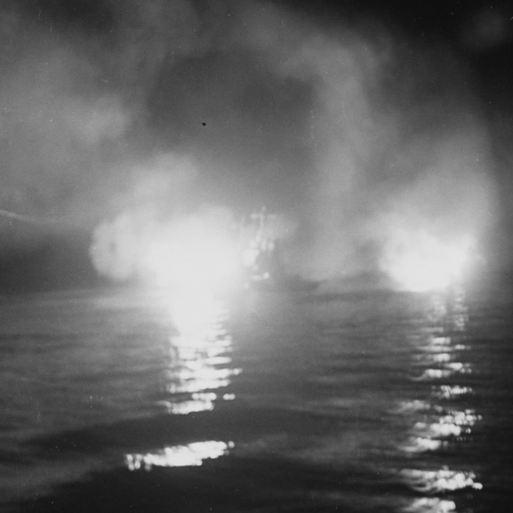 The cruiser USS Helena, center, fires during the battle of Kula Gulf, July 1943, just before she was torpedoed and sunk.