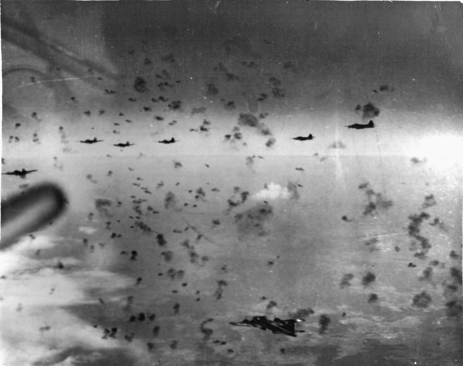 Bomber crews had no defense against anti-aircraft artillery fire. Here B-17s of the 381st Bomb Group fly through deadly bursts of flak over Schweinfurt, 1943. 