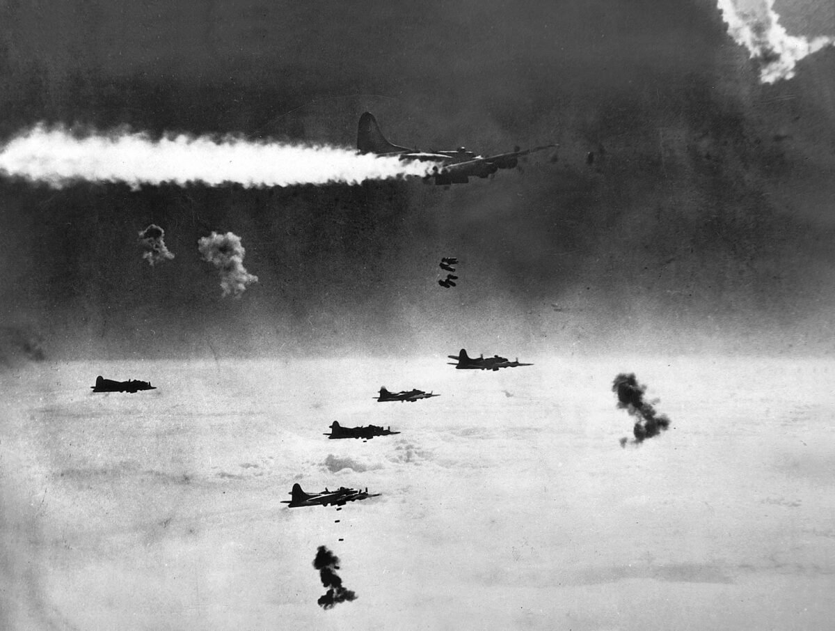 Despite being on fire and surrounded by flak bursts, this B-17 stayed in formation to drop its bombs on Berlin. The bombers were most vulnerable on the bomb run, when they had to fly straight and level for several minutes to ensure accuracy. 