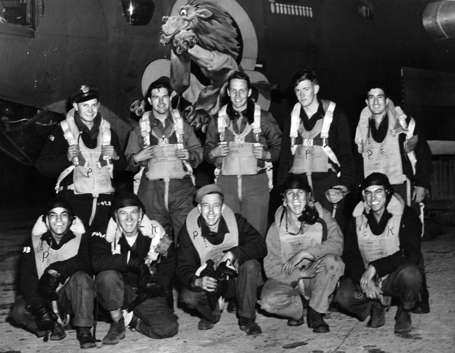 Lynn Tipton (left, back row), 493rd BG, poses with his smiling crew at RAF Debach before a bombing mission. 