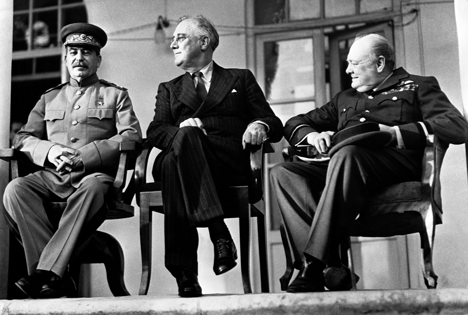 The “Big Three”—Stalin, Roosevelt, Churchill—pose for cameras during their strategy meetings in Tehran, Iran, in 1943. Churchill feared that a U.S.-British defeat in Normandy would allow Stalin to dominate the Continent. 