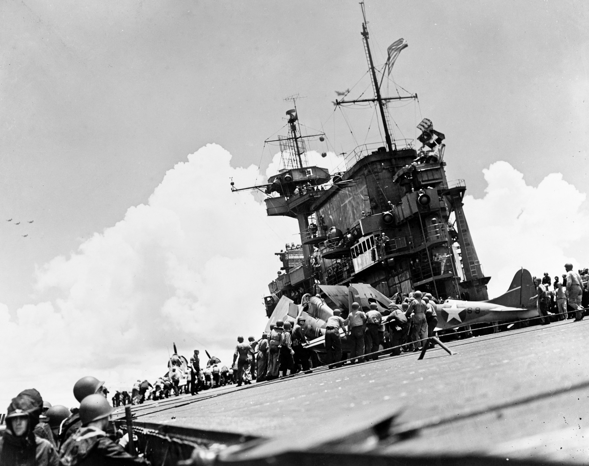 Plane-handling crews aboard USS Enterprise (CV-6) work to prepare an F4F Wildcat for flight during the Battle of the Santa Cruz Islands, October 26, 1942. The “Big E” would survive the war. Although the battle was a short-term victory for the Japanese in terms of ships sunk and damaged, Japan’s loss of many irreplaceable aircrews—particularly flight leaders—proved to be a long-term strategic advantage for the Allies in the Pacific.