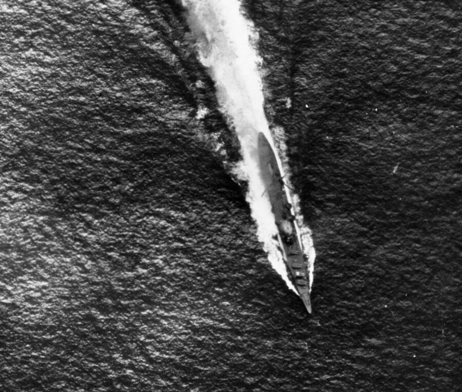 Heavy cruiser Chokuma under air attack photographed by a plane from Enterprise. Note gray smoke streaming from her bridge area, which has been hit by a bomb. 