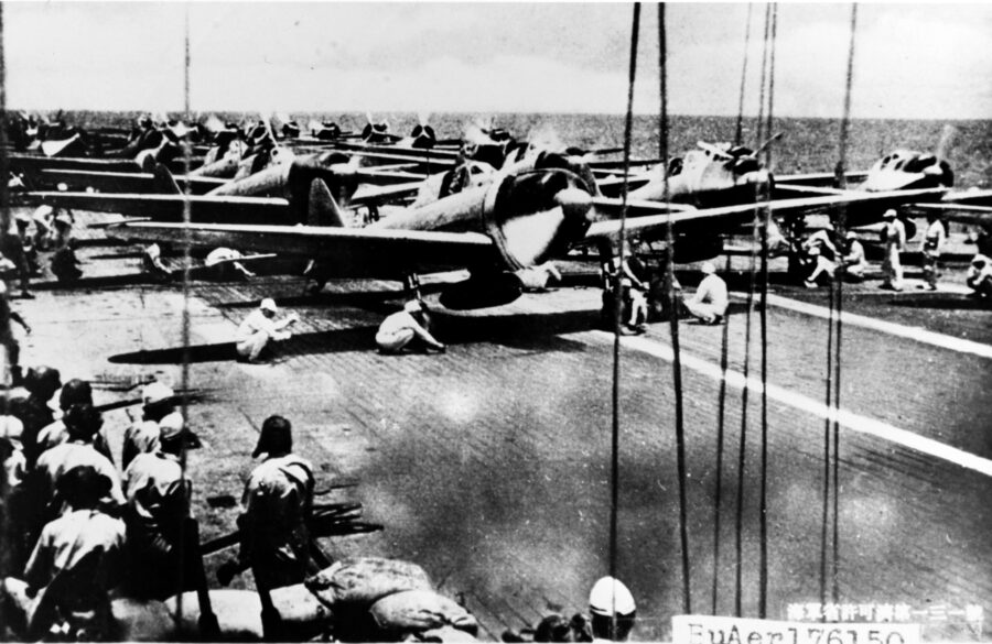 Crewmen, probably on Shokaku, ready a Mitsubishi A6M6 Model 21 (Allied codename “Zeke”) for takeoff on the morning of October 26, 1942.