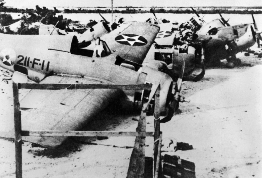 Wrecked Grumman  F4F Wildcat fighters  of VMF-211 litter  Wake’s airfield after  the island fell. All 12  of the Marines’ planes  were destroyed during the defensive stand.