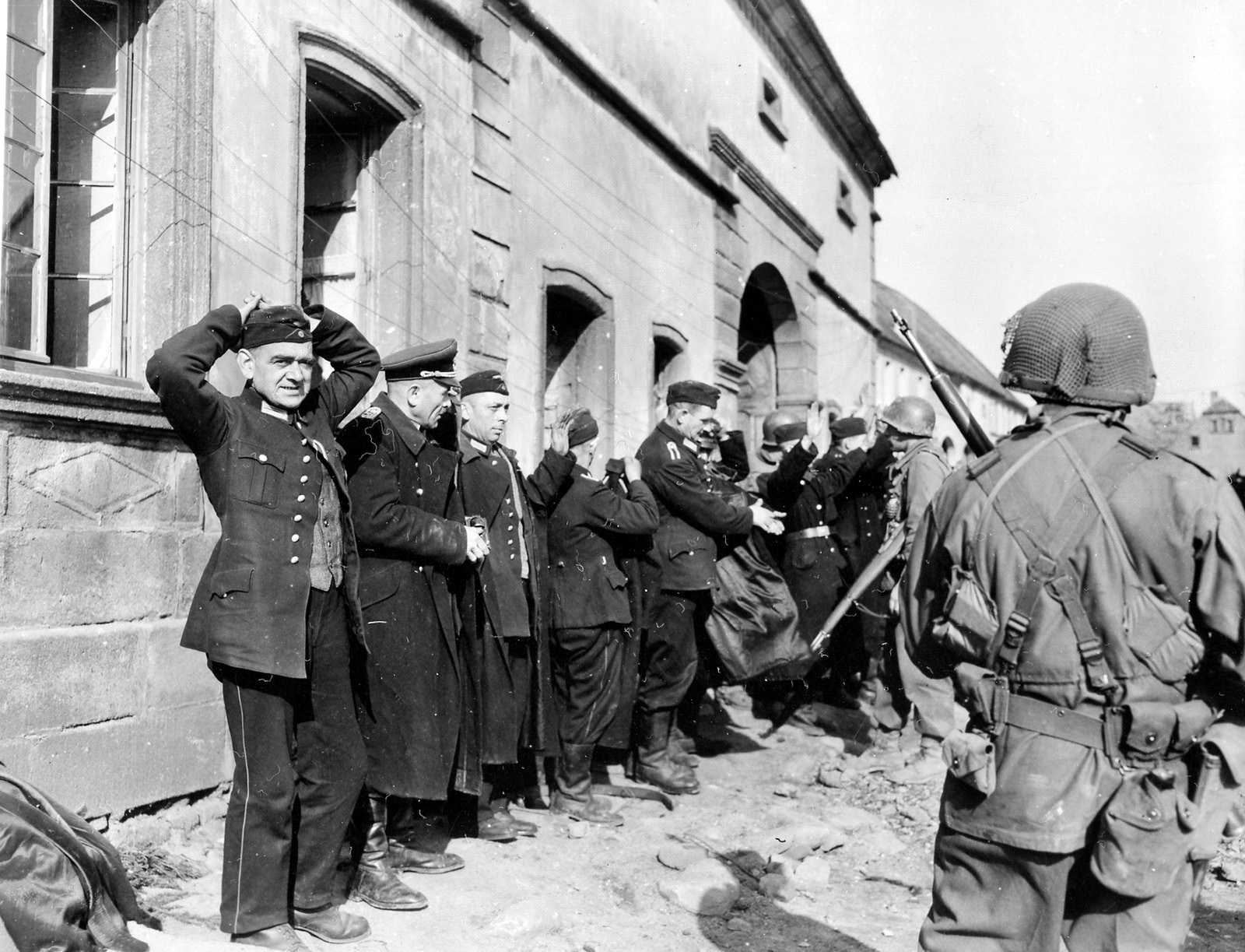 Having lost the will to fight, German troops in Konken, a village close to the Wehrmacht’s training area at Baumholder in southwest Germany, surrender to TF Richardson, March 1945.