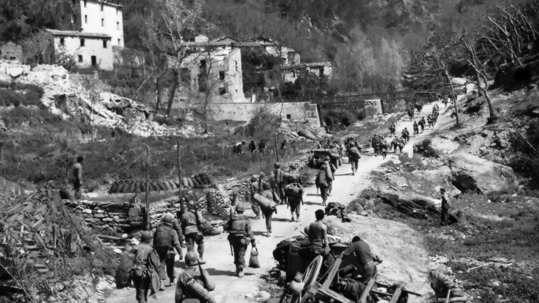 American soldiers of the 92nd Infantry Division move into the town of Moninoso, Italy, in April 1945. The 92nd was one of several Black outfits of the U.S. Army that served in the Italian campaign during World War II.