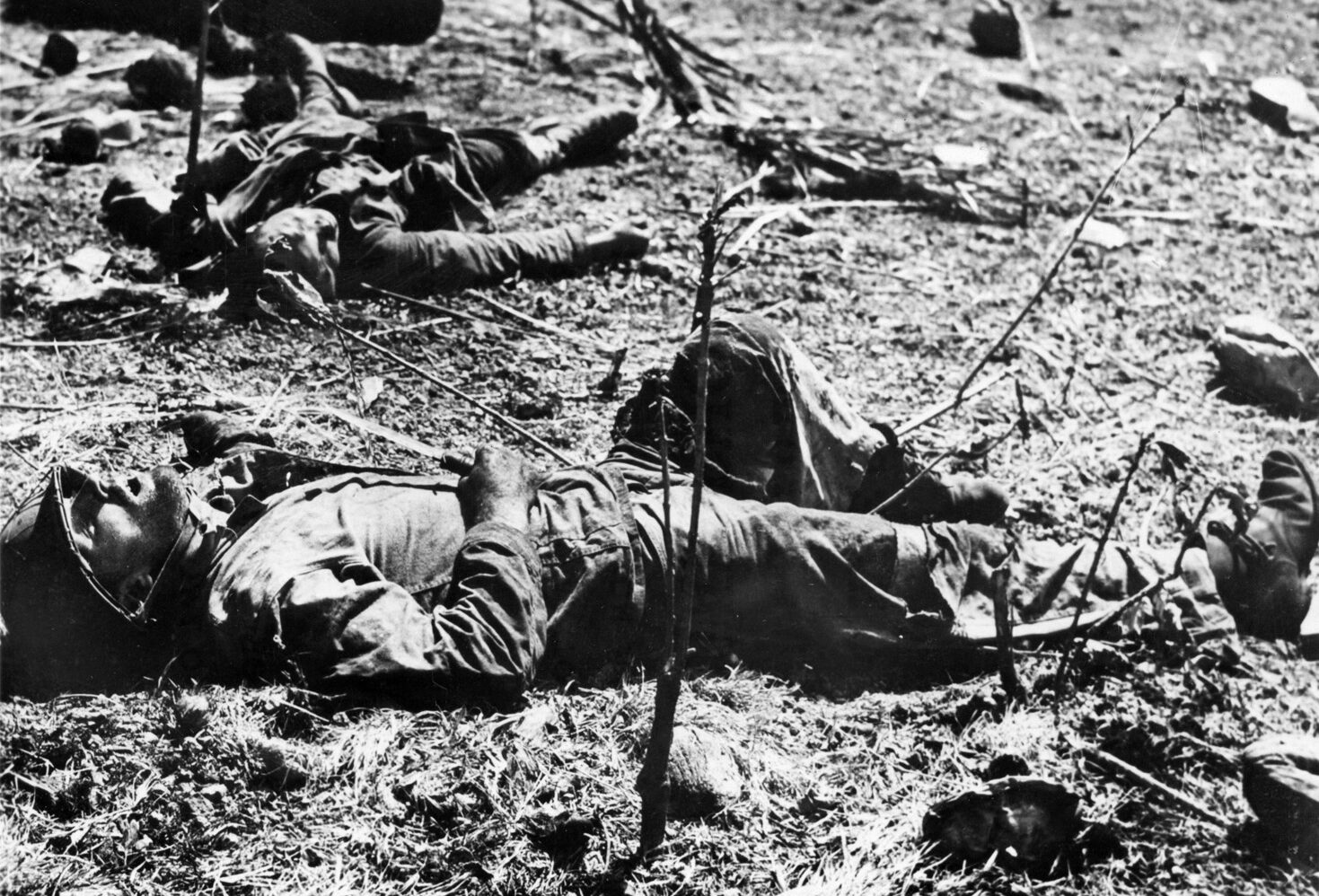 A dead Japanese soldier and a dead U.S. Marine (foreground) lie in close proximity, providing mute testimony to the close-quarter savagery of the combat on Guadalcanal. The Marine still clutches a fighting knife.