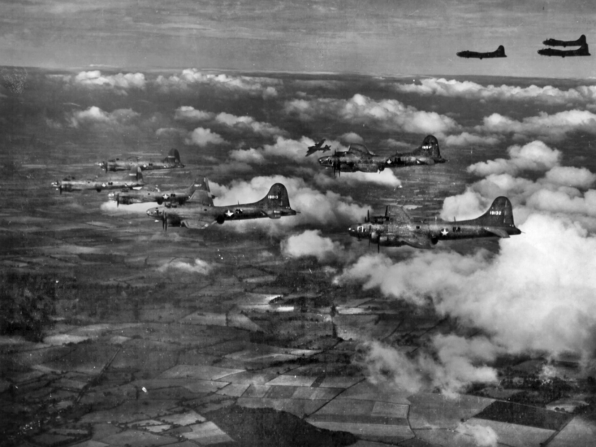 These Boeing B-17 Flying Fortress bombers, shown during a practice flight over England, flew the first combat mission over Europe during a bombing raid against Nazi-occupied Europe carried out by American aircraft.