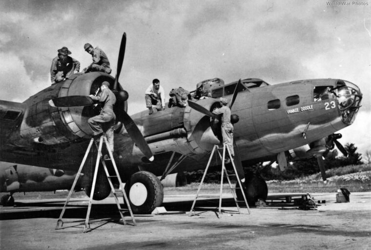 Ground crewmen check the B-17 Flying Fortress Yankee Doodle of the 97th Bomb Group, which participated in the first bombing raid of U.S. Eighth Air Force planes in World War II, targeting the railroad marshaling yards at Sotteville, near Rouen in northern France, on August 17, 1942. Eaker was aboard as an observer.