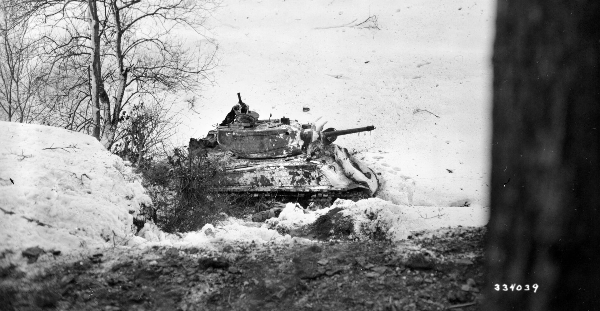  An M4 Sherman tank of the 737th Tank Battalion has hit an icy patch and skidded off a road in Luxembourg while supporting the 5th Infantry Division’s movement toward German positions.