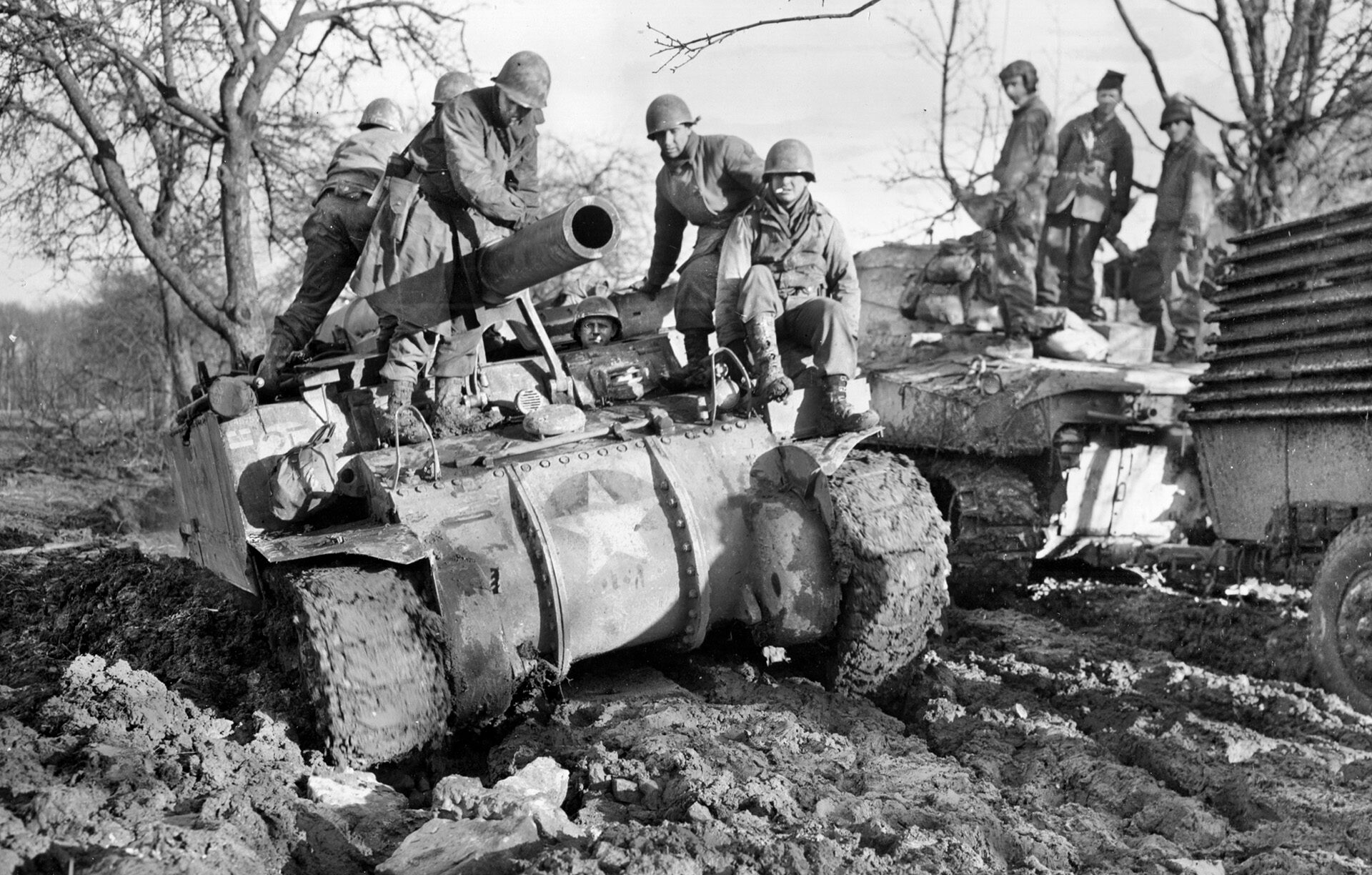 This self-propelled 155mm gun of the 737th Tank Battalion struggles through thick mud as it crosses the countryside in Luxembourg. Winter weather hindered the progress of the armor in support of the 5th Infantry Division advance of early 1945. 