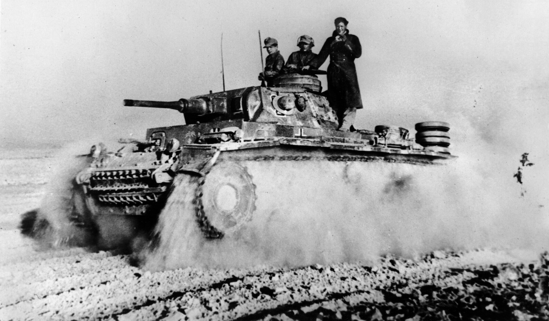 A PzKpfw. III churns up a cloud of desert sand as it advances across the battlefield in June 1942. The German victory at Gazala sent the British reeling back across the Egyptian frontier to El Alamein.