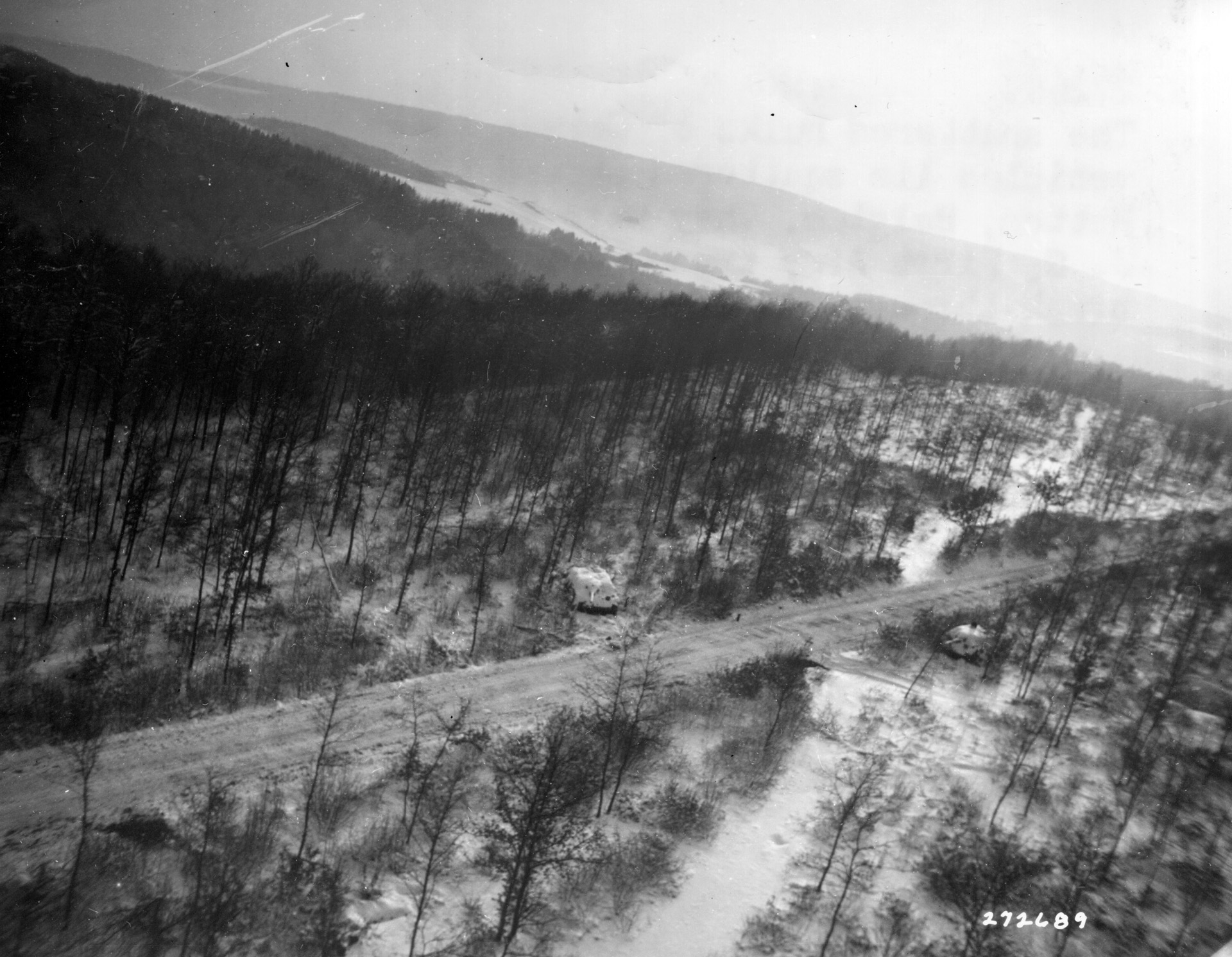 The abandoned hulks of two German armored vehicles, probably Sturmgeschutze assault guns, are pictured in this aerial image taken after the battle at Hotton.