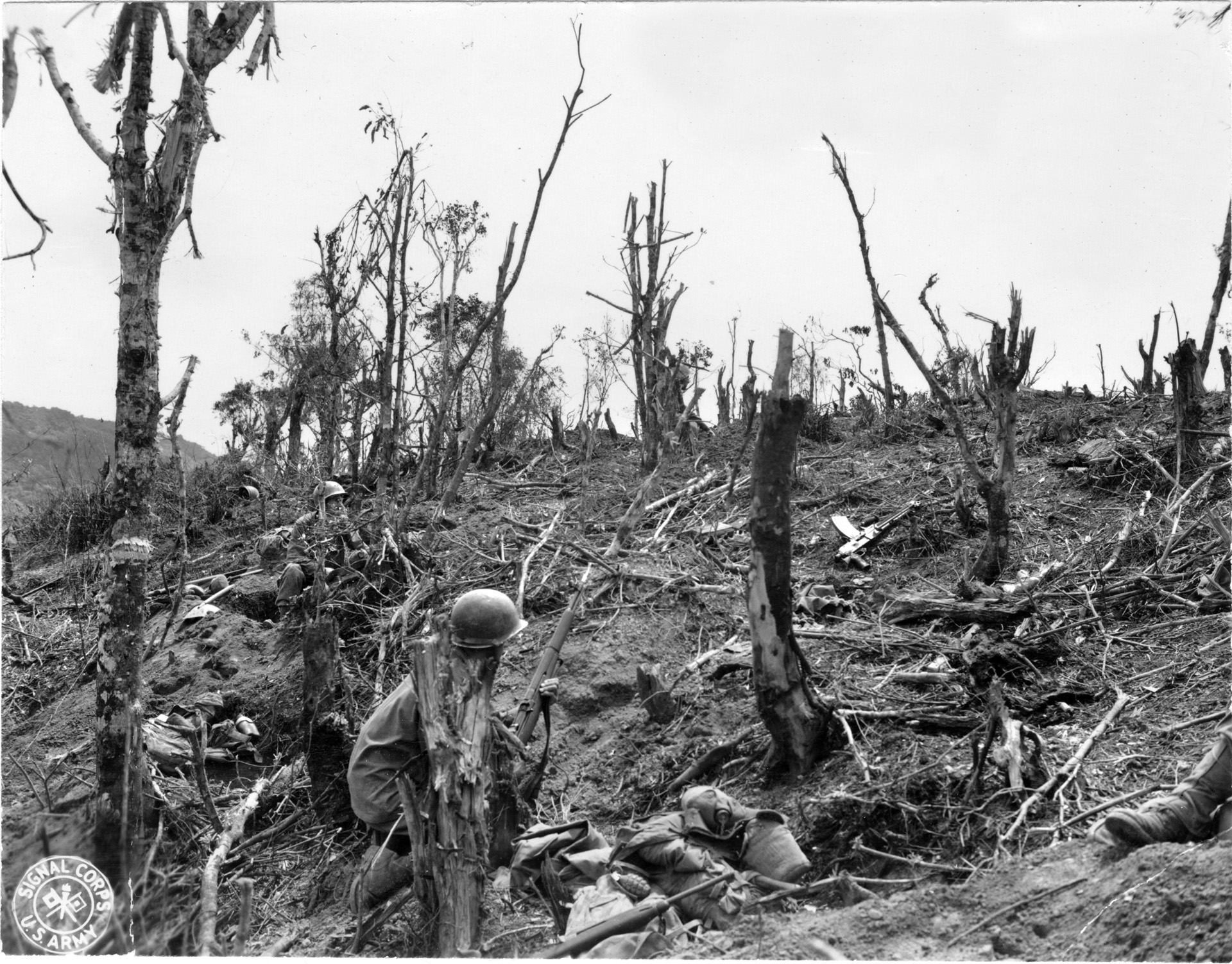Soldiers of the 32nd Infantry Division are shown during combat operations on the island of Luzon in the Philippines in April 1945. The 32nd Division recorded the highest number of days in a combat zone of any American division during World War II: 654 days in the Pacific while fighting the Japanese.