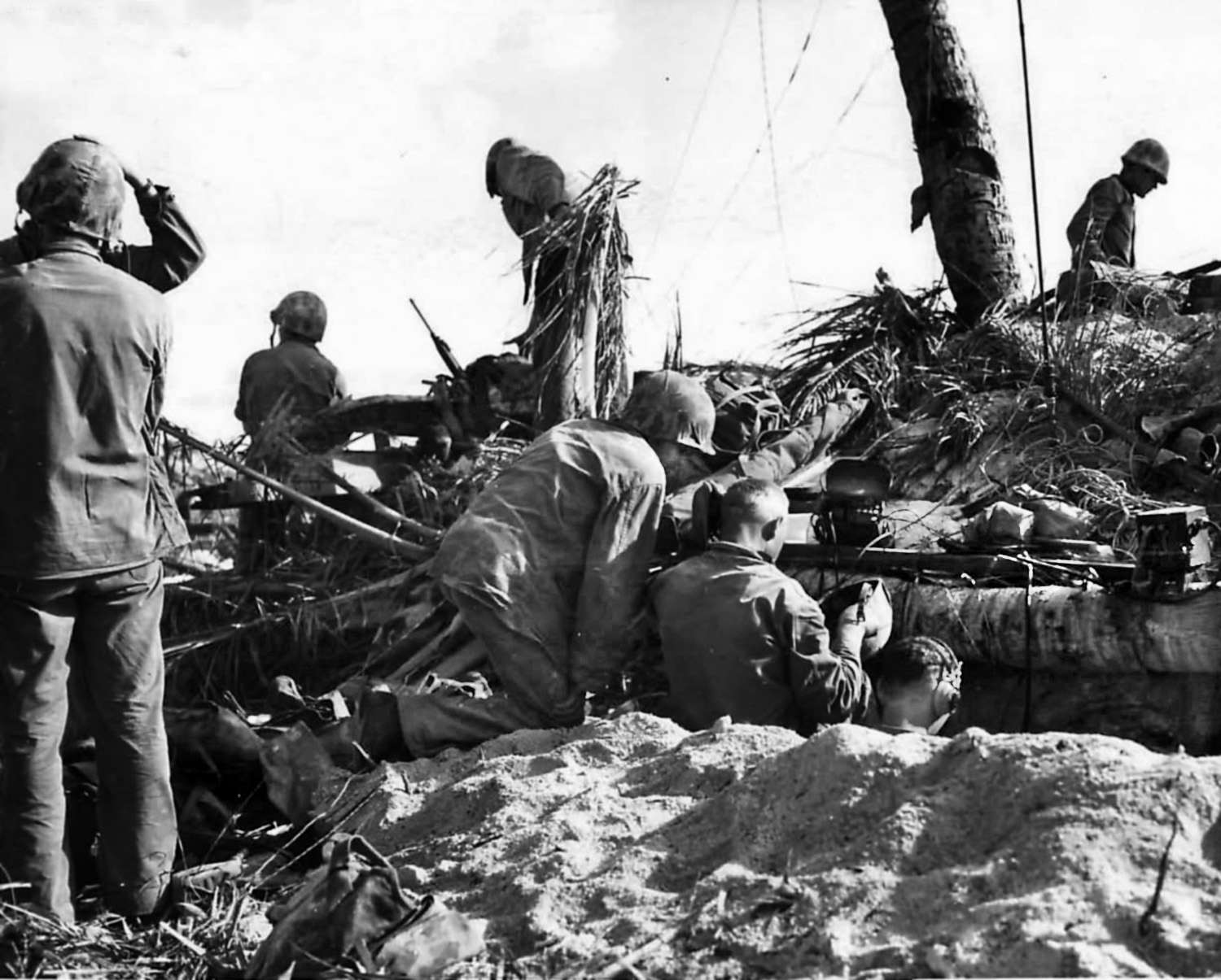 Marines man a field telephone during the fighting on the islet of Betio at Tarawa Atoll, where shortcomings of some of the radio equipment used by U.S. Marines were exposed. 