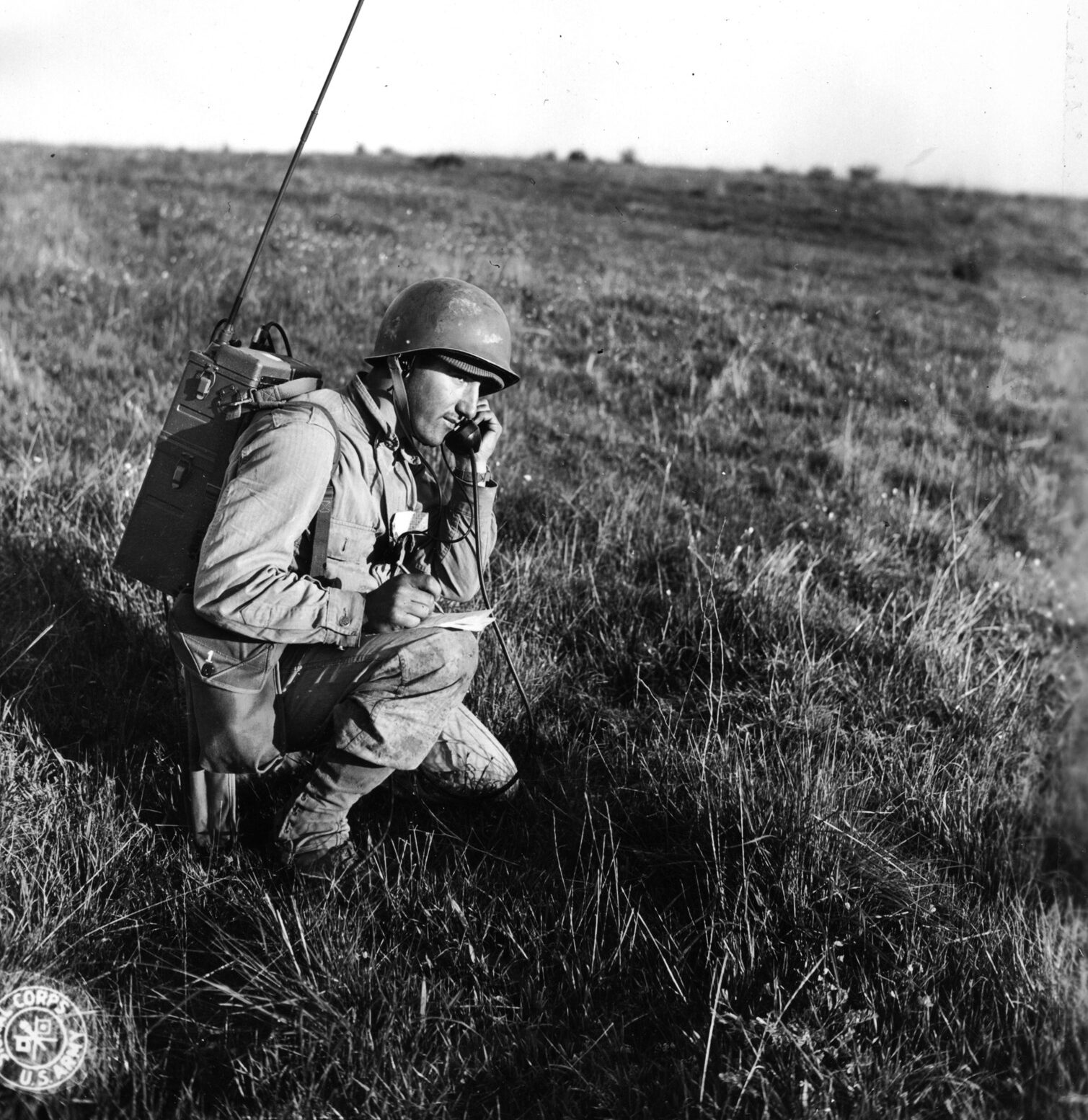 A soldier trains with an SCR 300 radio set, including a talking apparatus and a heavy backpack. The SCR 300 had a range of up to three miles, operating on FM (frequency modulation) and becoming the world’s first true ‘Walkie Talkie.’
