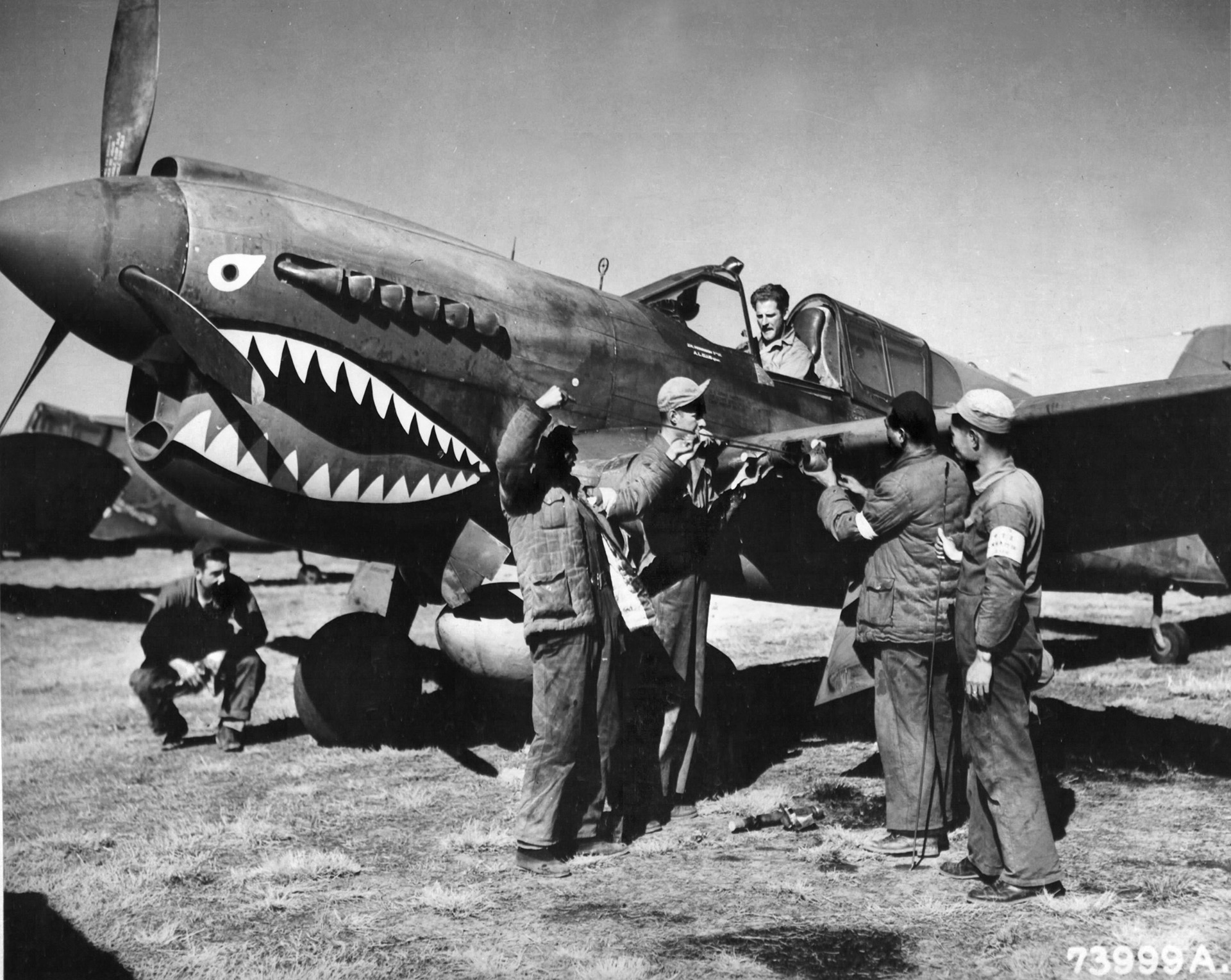 Chinese and American ground crewmen service a Curtiss P-40 Warhawk of the U.S. 28th Fighter Group in China. Merian A. Cooper, famed as a Hollywood producer, served as the unit’s commander and chief of staff to General Claire Chennault in China.