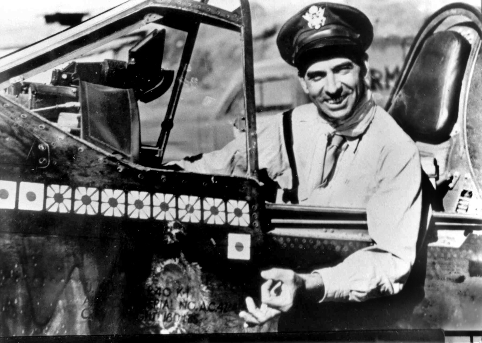 Robert L. Scott, a fighter ace in China, served with Cooper in China after the two officers became friends. Note the Japanese flags painted on the fuselage of Scott’s Curtiss P-40 Warhawk fighter, signifying aerial victories in combat against the enemy.