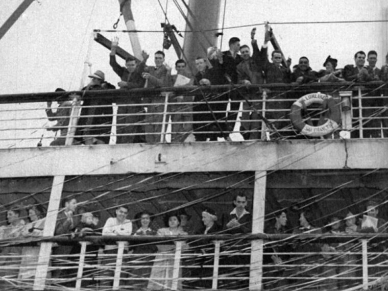 Members of the Willamette and San Jose State University football teams and other passengers wave to friends and family on the docks at San Francisco as the steamer SS Lurline pulls away on November 27, 1941.