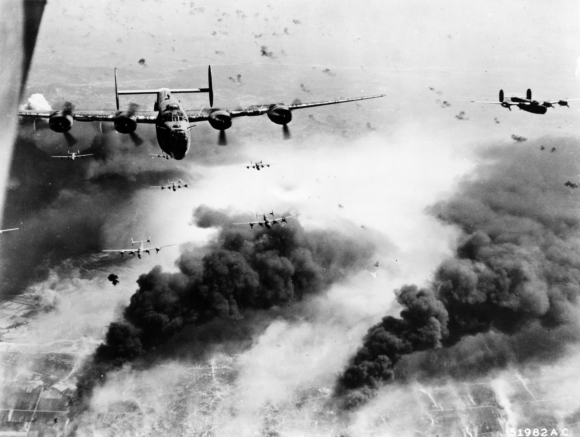  Consolidated B-24 Liberator heavy bombers endure intense enemy flak during one of several air raids against oil refineries in the Ploesti, Romania, area. Many of the American airmen shot down during the costly Ploesti raids found their way to Yugoslavia and were assisted in escape and evasion by Chetnik fighters.