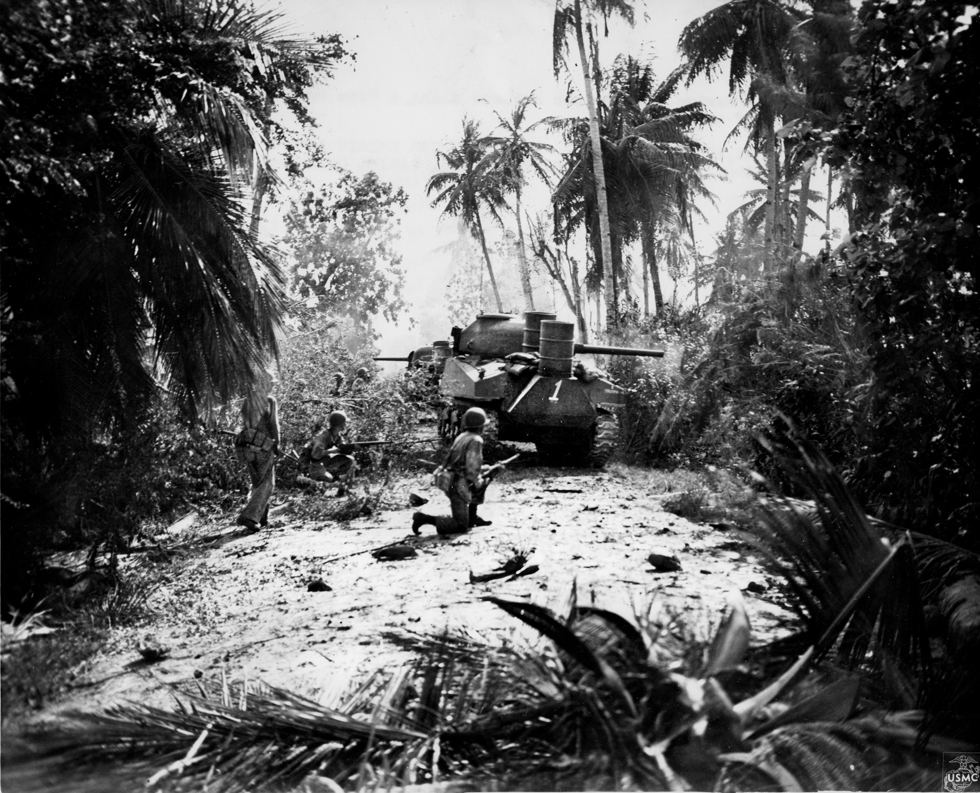 A pair of M4 Sherman medium tanks from the 706th Tank Battalion leads the way for U.S. Marines advancing through the jungle on the island of Guam in the summer of 1944. The Sherman’s 75mm cannon outgunned Japanese tanks and suppressed Japanese sniper fire.