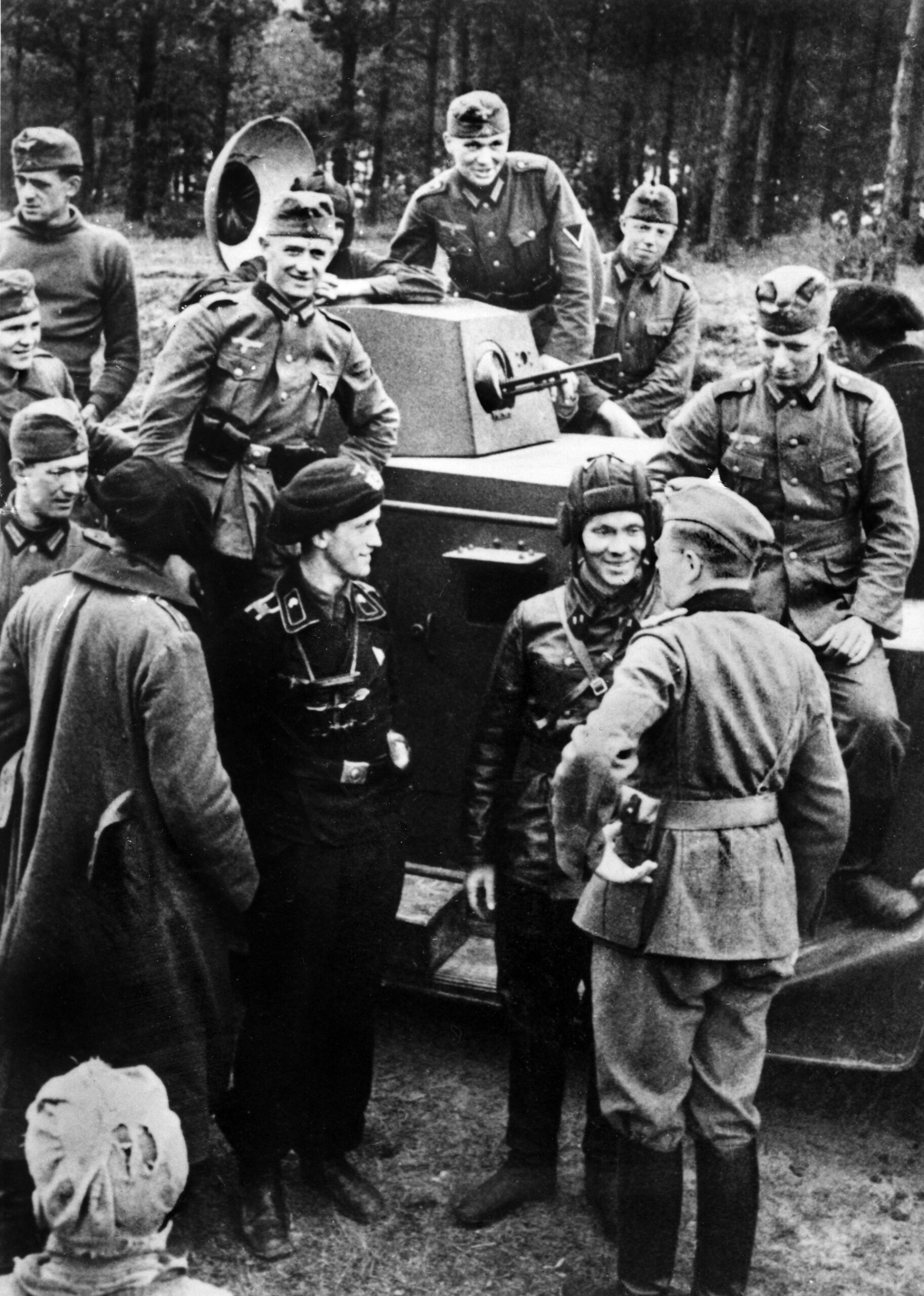 Red Army meets Wehrmacht in this photo as invading German and Soviet soldiers gather around a Soviet tank somewhere in Poland. The Nazis and Soviets concluded a non-aggression pact in 1939 and agreed in a secret protocol to invade Poland from west and then east, dismembering the country.