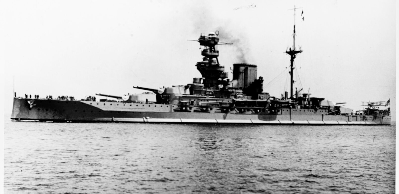 The battleship HMS Valiant makes headway at sea.  Philip was commended for his handling of one of the British searchlights on Valiant during the Battle of Cape Matapan in March 1941. 