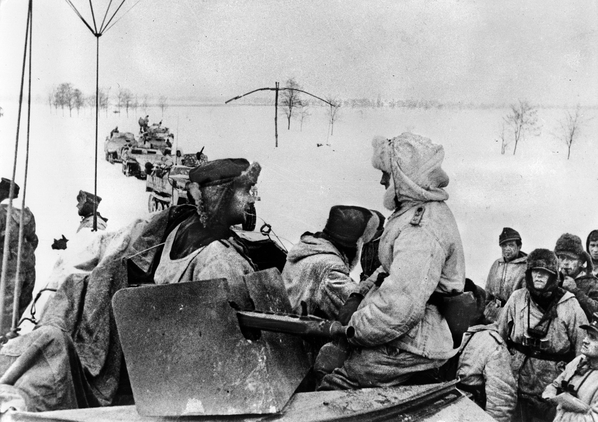 Dressed in winter combat gear to provide camouflage across the snow-covered countryside, German panzergrenadiers climb aboard halftracks in preparation for an offensive against the Soviet Red Army in the early spring of 1945. Operation Spring Awakening was devised as a means of defending access to Hungarian oil fields, which were vital to the German armed forces.