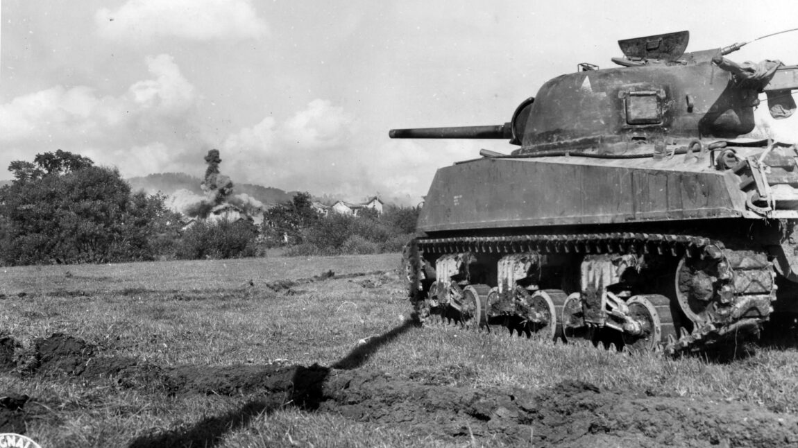 A Third Army M4 Sherman engages German targets with its 75mm cannon west of Arracourt in late 1944. 