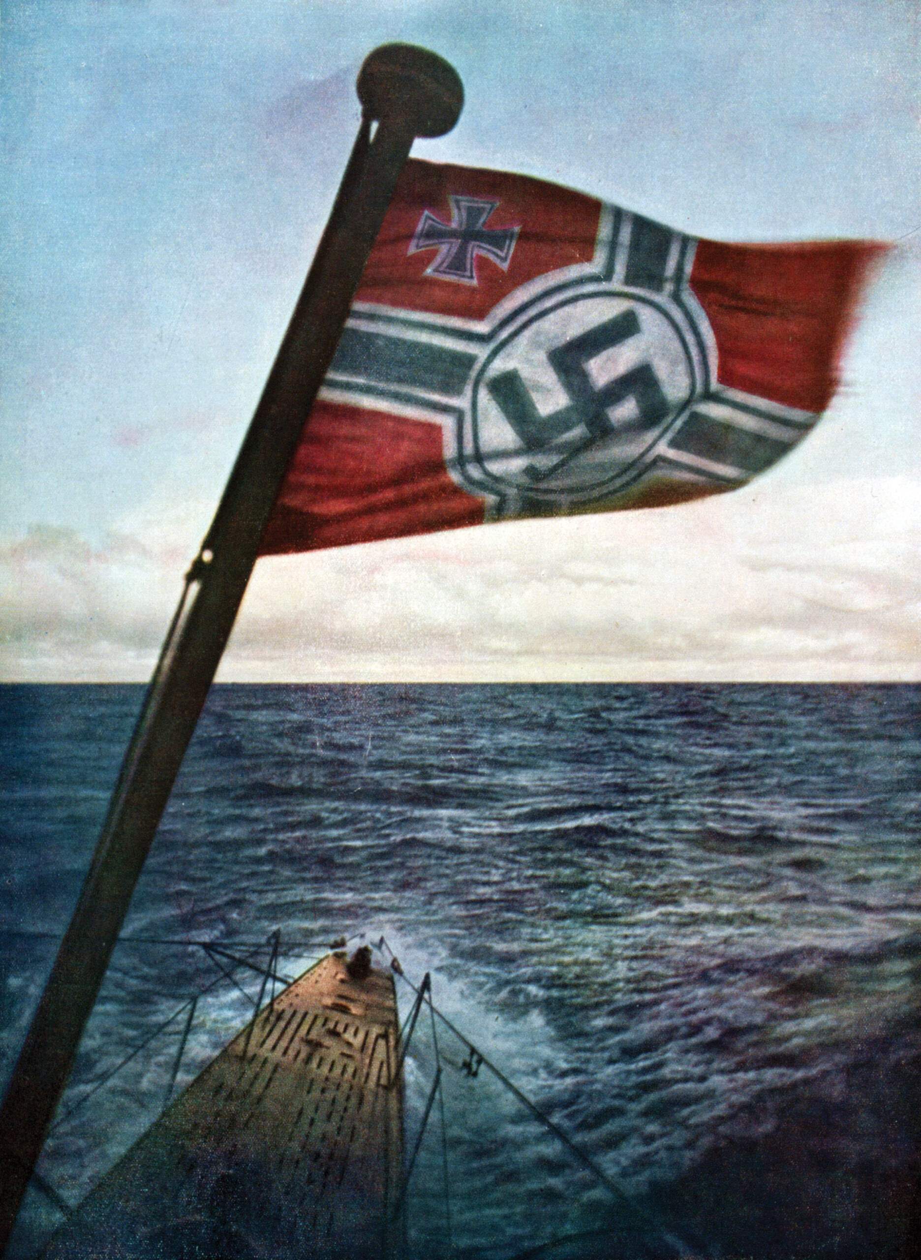 The swastika flag whips in the winds of the Atlantic Ocean from a surfaced Nazi U-boat. The U.S. Navy employed airships to combat the U-boat threat during World War II.