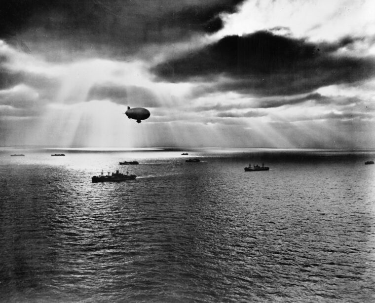 A U.S. Navy airship patrols the Atlantic Ocean above a convoy in June 1943. Airships were serving regularly in anti-submarine patrols during the Battle of the Atlantic.