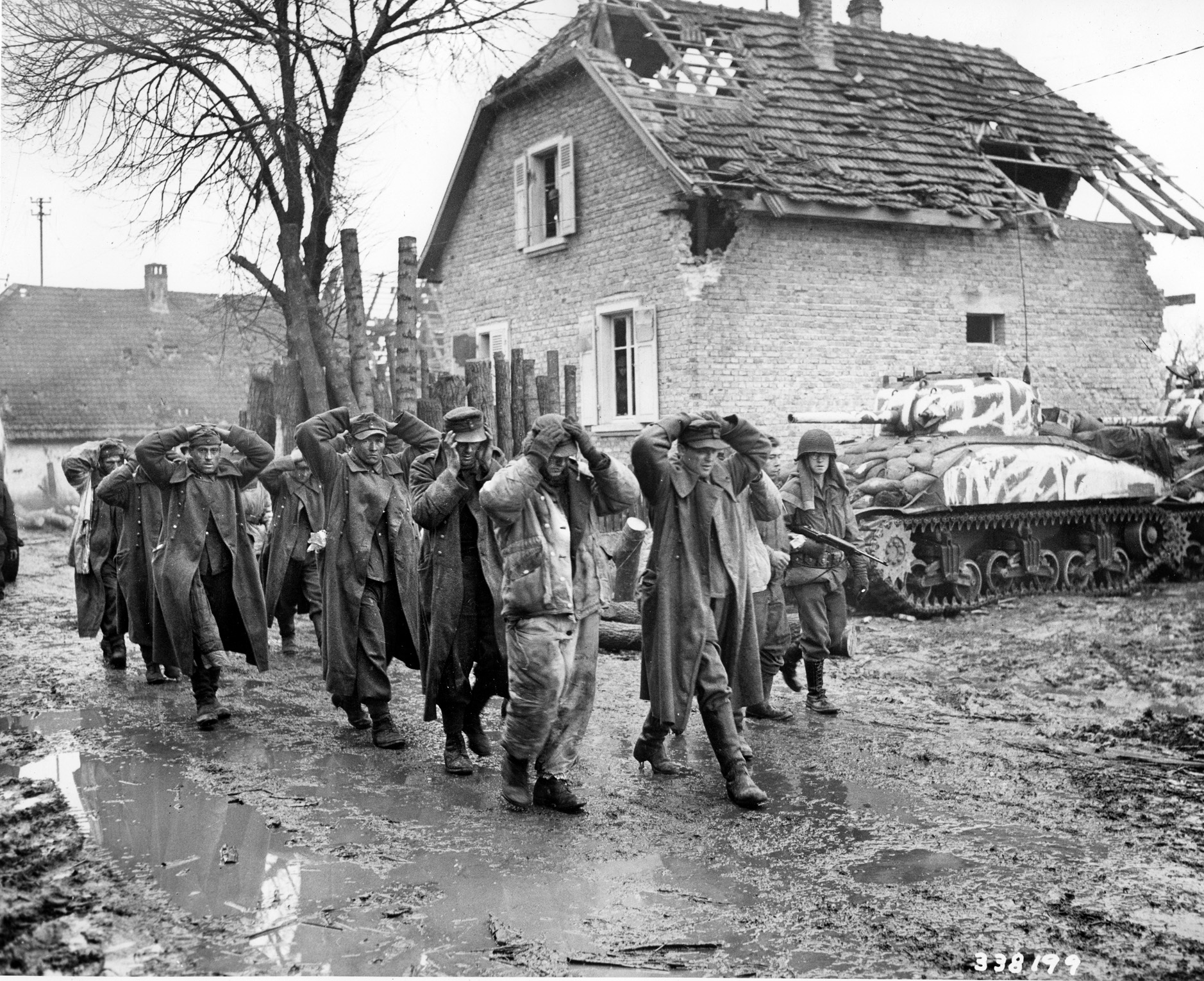 Bush returned to his unit in time to participate in the Battle for the Colmar Pocket, where he found that Germans in the regular army easily surrendered, but the SS soldiers rarely surrendered. Here, soldiers with the 75th Infantry Division escort surrendering Germans to the rear on February 1, 1945.