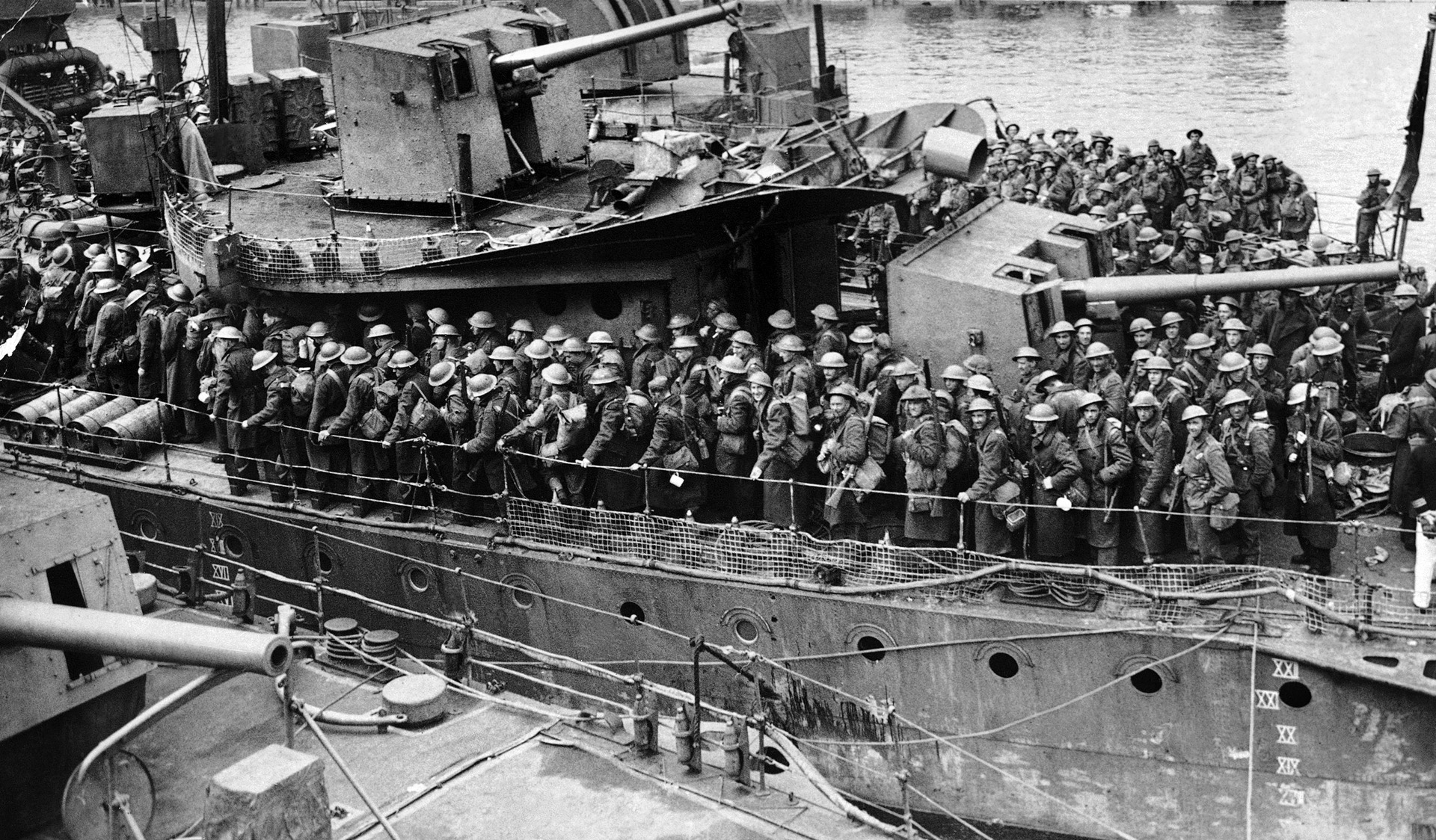 British soldiers, freshly rescued from Dunkirk, crowd the rail of a Royal Navy ship that is preparing to dock at a port in Britain on June 1, 1940. Admiral Sir Bertram Ramsay led the successful effort of Operation Dynamo.