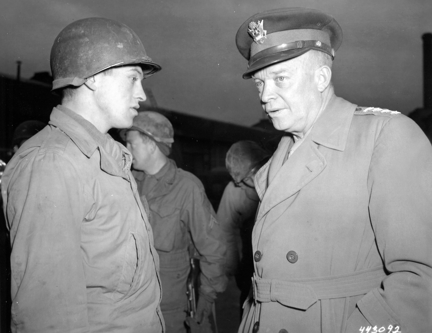 Eisenhower talks with Private William J. Forgus, of Columbus, Ohio, who served in an ordnance unit.